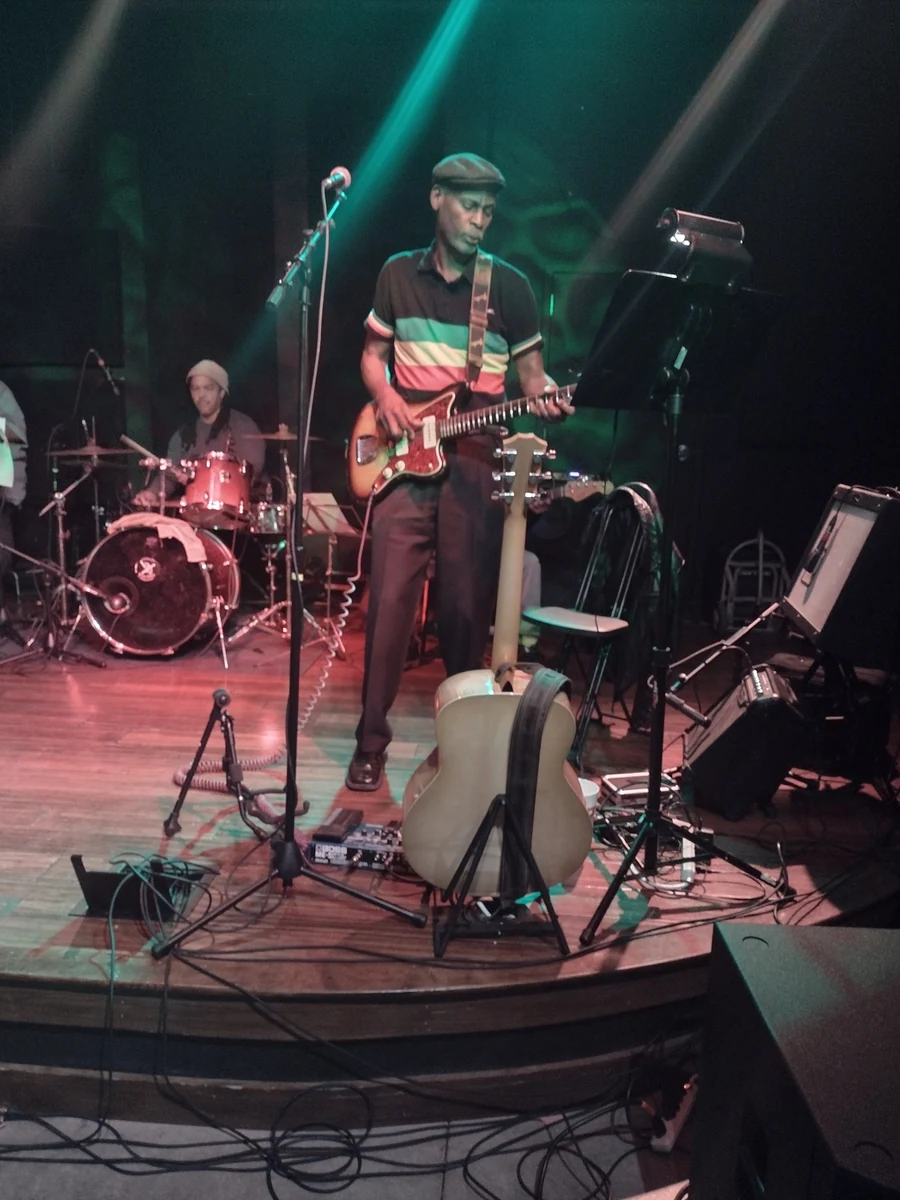Jody Carter performing on stage with guitar